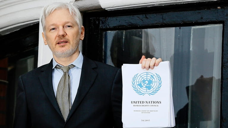 WikiLeaks founder Julian Assange speaks on the balcony of the...