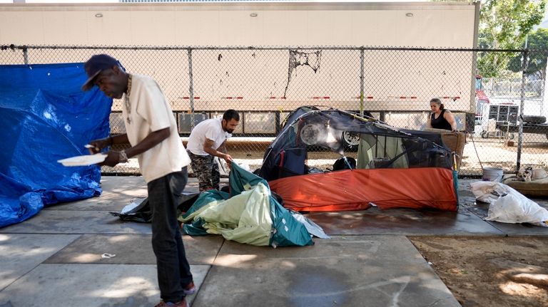 Tents are set up at an encampment Thursday, July 25,...