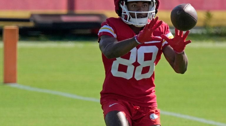 Kansas City Chiefs wide receiver Phillip Brooks catches a ball...