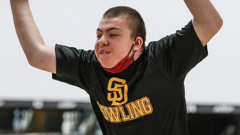 Peyton Hughes of Sewanhaka District reacts during the Nassau boys team bowling...