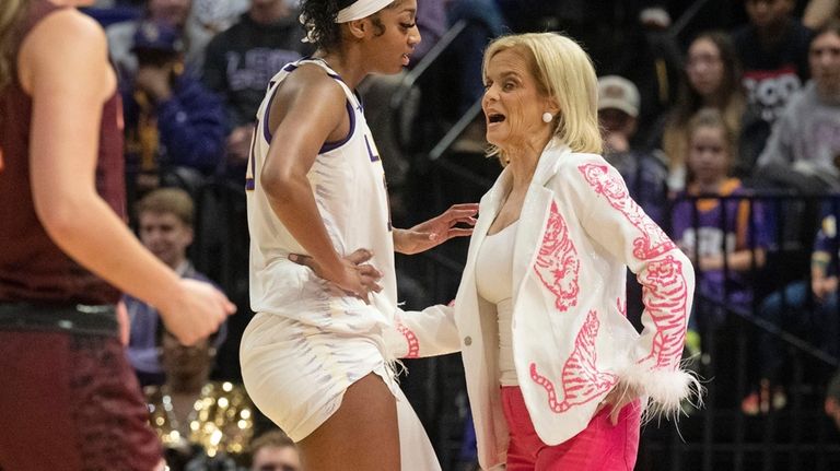 LSU coach Kim Mulkey speaks with forward Angel Reese (10)...