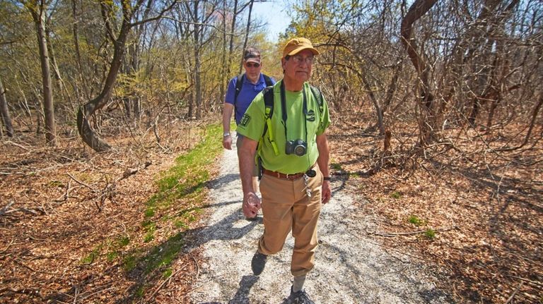 Kenneth Kindler, right, walks with Bob Albertson on the Ray...