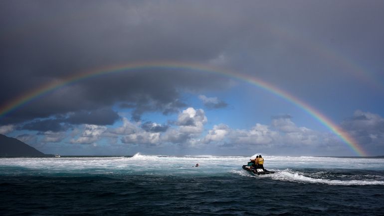 Members of the water safety team move into the impact...