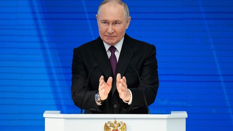 Russian President Vladimir Putin delivers his state-of-the-nation address in Moscow,...