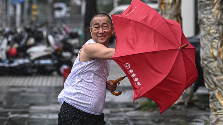 In this photo released by Xinhua News Agency, a man...