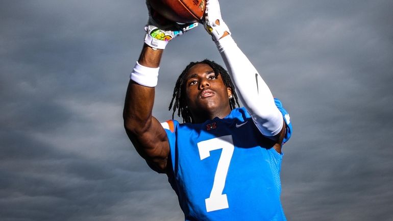 Malverne football player Josiah Brown at poses his home field...