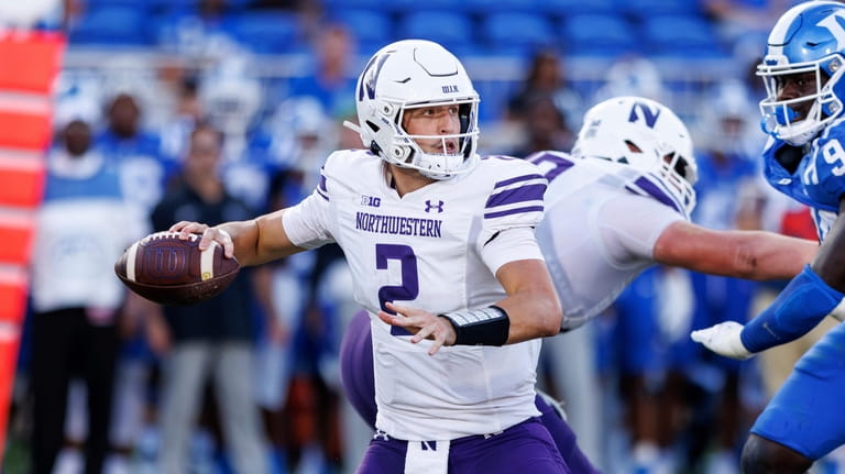 Northwestern's Ben Bryant (2) looks to pass during the second...