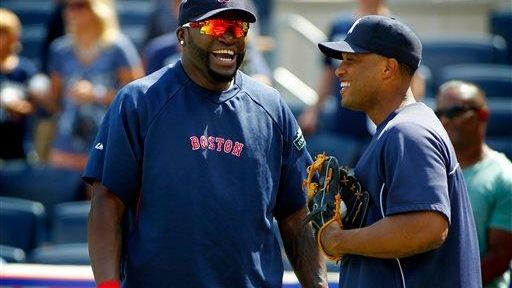 Boston Red Sox designated hitter David Ortiz, left, chats with...