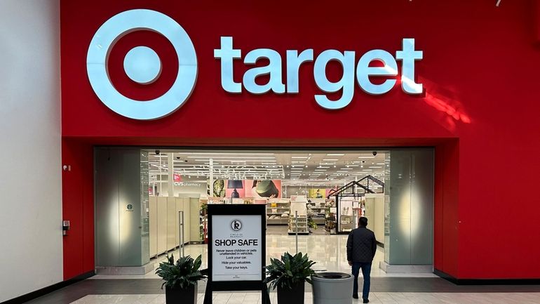 A shopper heads into a Target store on Jan. 11,...