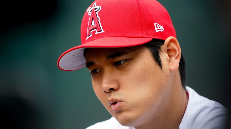 American League's Shohei Ohtani, of the Los Angeles Angels, reacts...