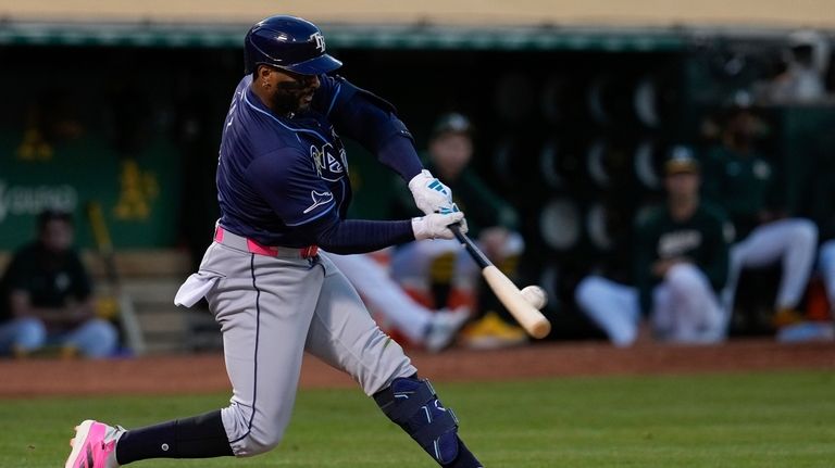 Tampa Bay Rays' Yandy Díaz hits a double during the...