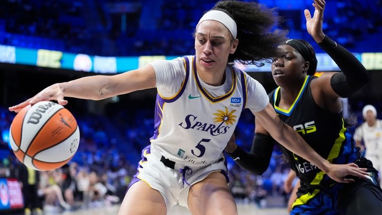 Los Angeles Sparks forward Dearica Hamby (5) tries to keep...