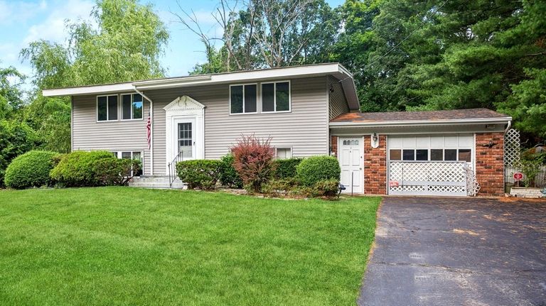 This $479,990 East Setauket home sits on 0.35 acre.