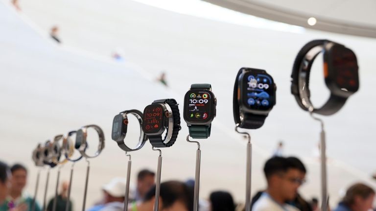 Apple Watches are displayed during an announcement of new products...