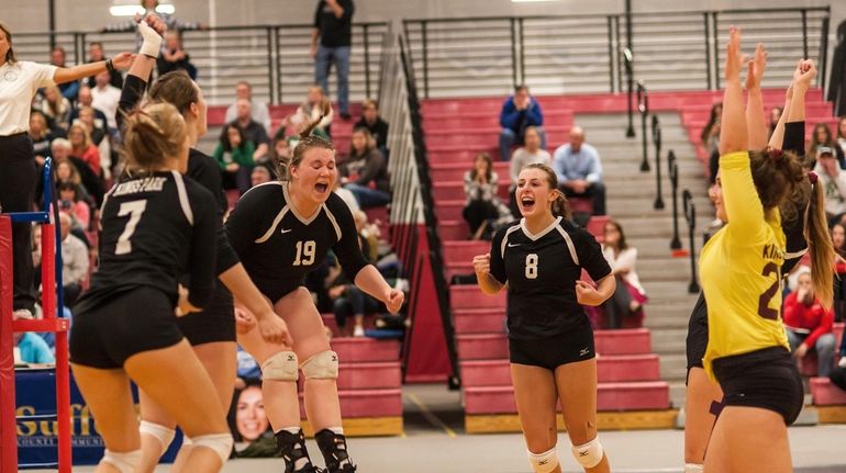 Kings Park players celebrate their win over Westhampton in the...