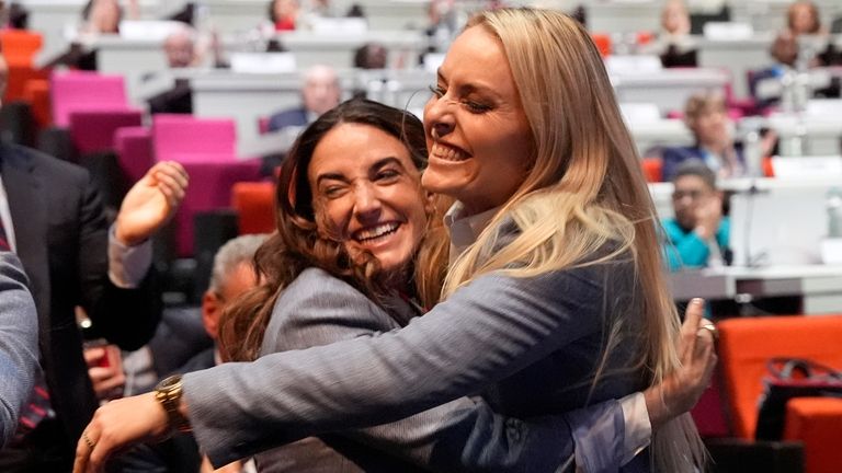 Former US skier Lindsey Vonn, right, hugs US Paralympic athlete...