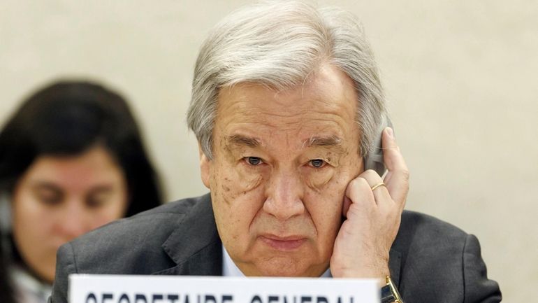 U.N. Secretary-General Antonio Guterres listens to a speech during the...