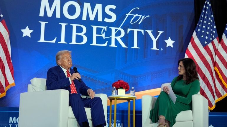 Republican presidential nominee former President Donald Trump speaks with Moms...