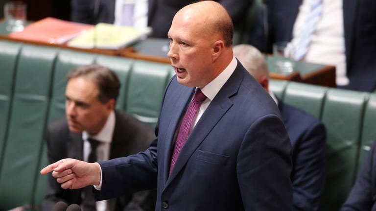 Australia's then Defense Minister Peter Dutton addresses Parliament House in...