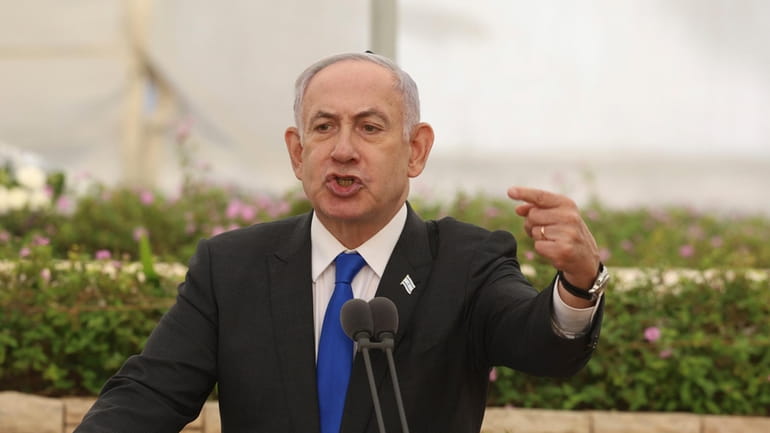 Israeli Prime Minister Benjamin Netanyahu speaks during a ceremony at...