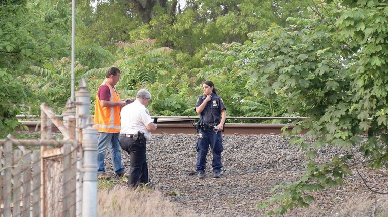 MTA police and Freeport police investigate on Saturday after a...