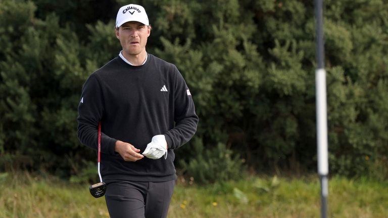 Denmark's Rasmus Hojgaard putting on the sixteenth green during day...