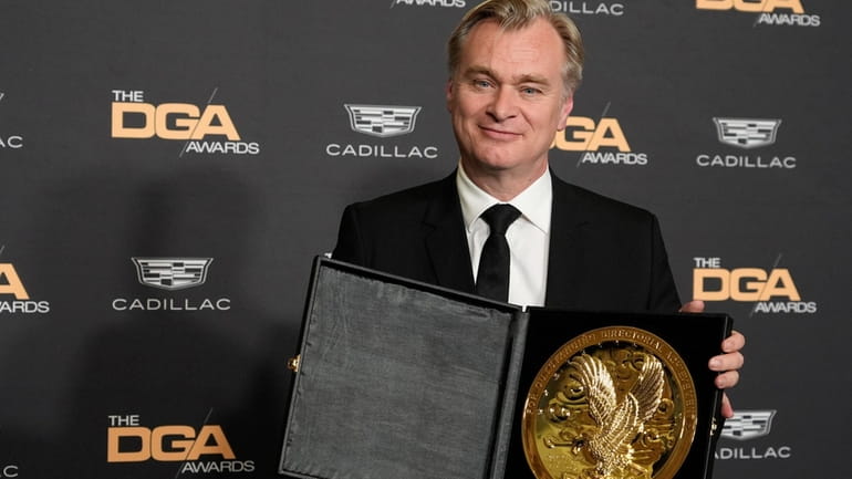 Christopher Nolan, director of the film "Oppenheimer," poses with his...