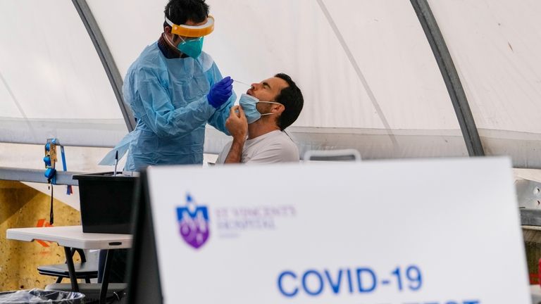 A man receives a COVID-19 test in the eastern suburbs...