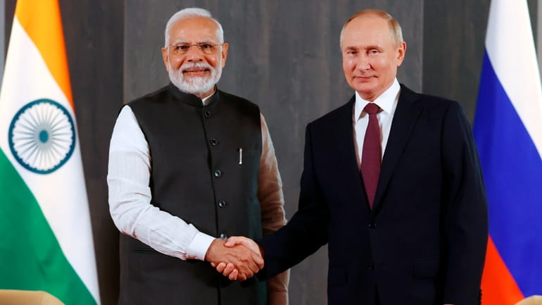 FILE -Russian President Vladimir Putin, right, and Indian Prime Minister...
