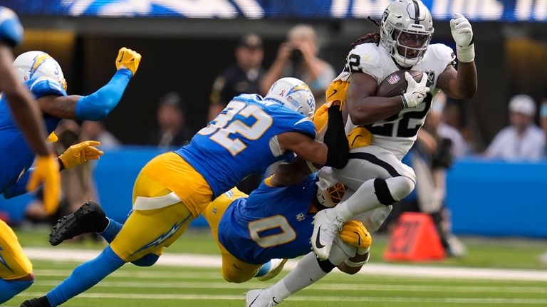 Las Vegas Raiders running back Alexander Mattison (22) runs against...