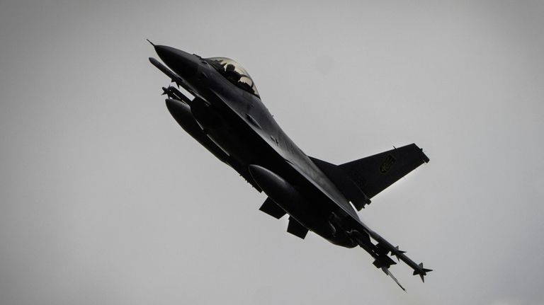 Ukrainian Air Force's F-16 fighter jet flies in an undisclosed...