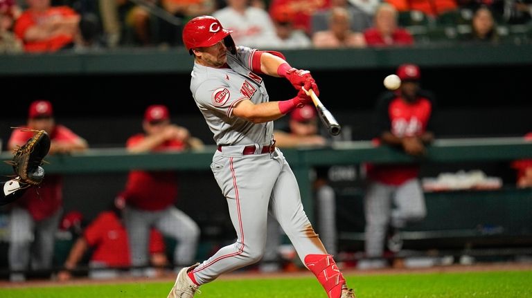 Cincinnati Reds' Spencer Steer connects for a two-run home run...