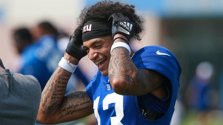 Giants wide receiver Jalin Hyatt smiles during training camp at the...