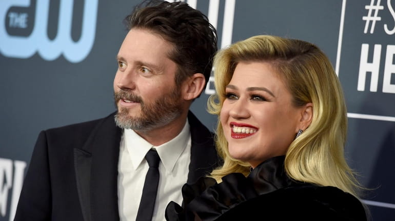 Brandon Blackstock, left, and Kelly Clarkson wed in 2013 and...