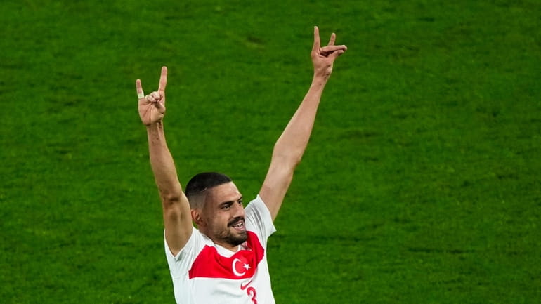 Turkey's Merih Demiral celebrates after scoring his side second goal...