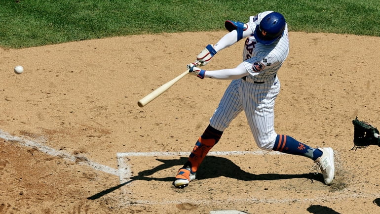 New York Mets' Brandon Nimmo hits a three-run double during...