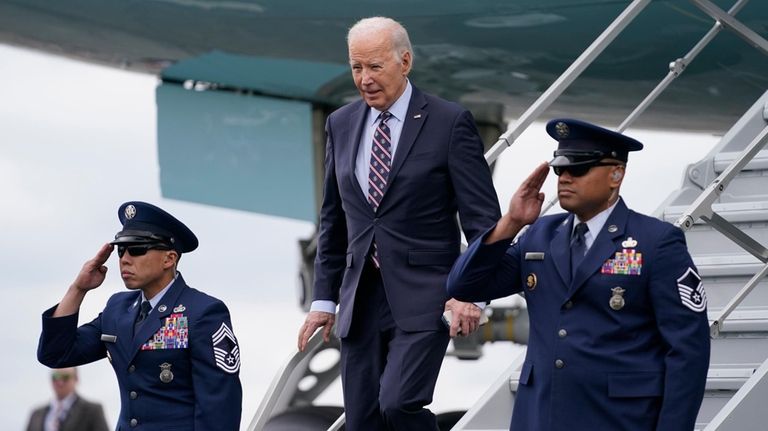 President Joe Biden arrives at Boston Logan International Airport to...