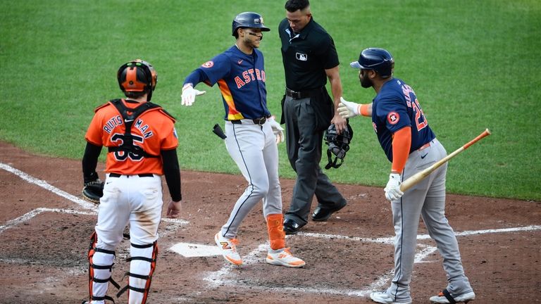 Houston Astros' Jeremy Pena, second from left, celebrates his home...