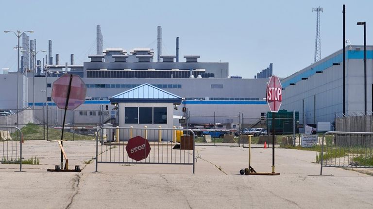 An entrance to the Stellantis factory in Belvidere. Ill., is...