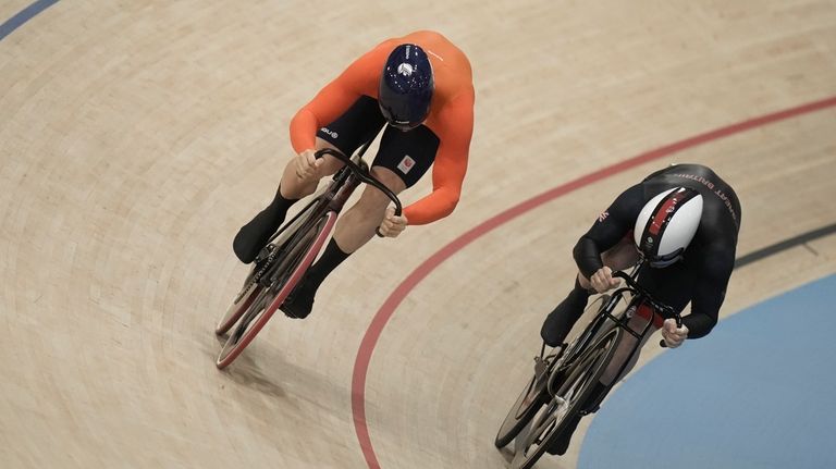 Harrie Lavreysen of Netherlands, left, and Jack Carlin of Britain...