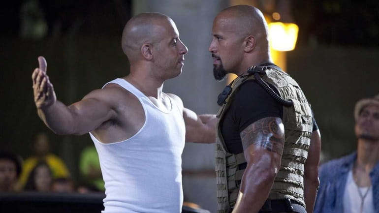 Dom Toretto (Vin Diesel), left, and Luke Hobbs (Dwayne Johnson),...