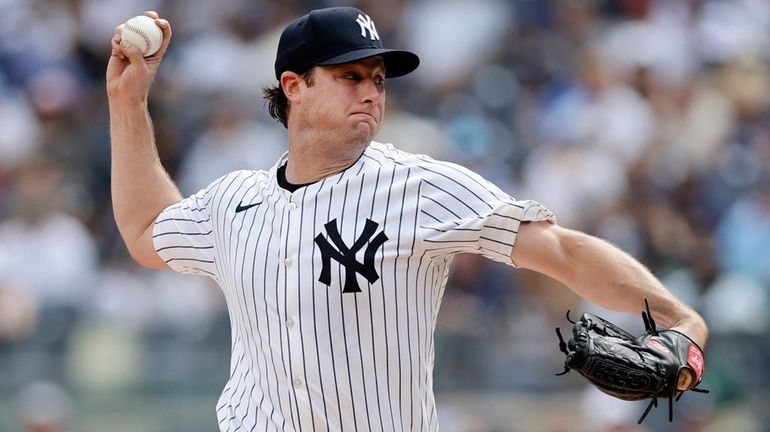 Gerrit Cole #45 of the Yankees pitches during the first...