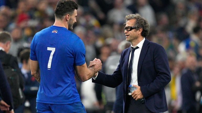 France's coach Fabien Galthie greets France's Charles Ollivon at the...