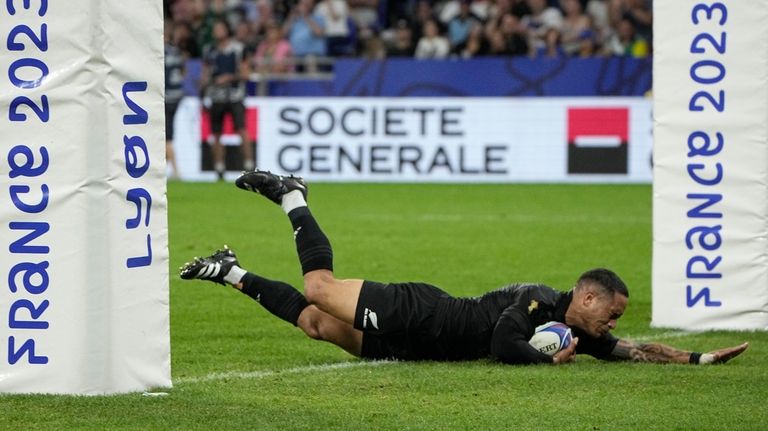 New Zealand's Aaron Smith scores a try during the Rugby...