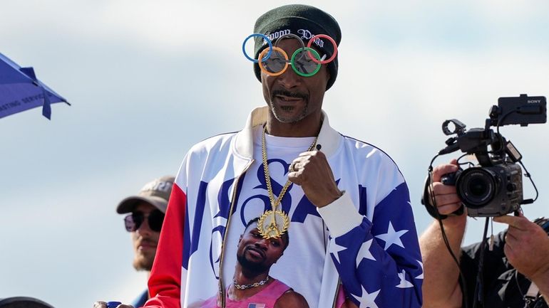 U.S. artist Snoop Dogg gestures during the men's skateboarding park...