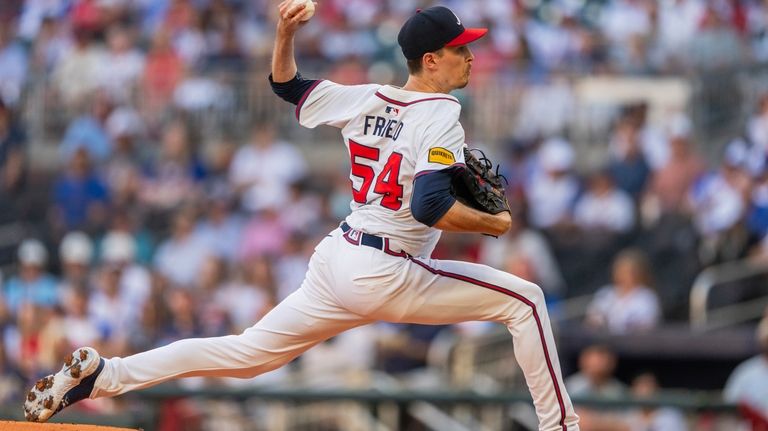 Atlanta Braves pitcher Max Fried (54) throws in the first...