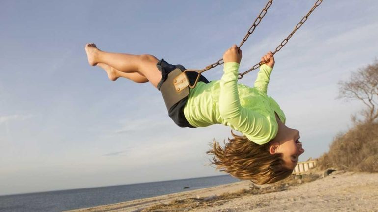 Courtney Kruk, 10, from Southold, welcomes the spring-like weather at...