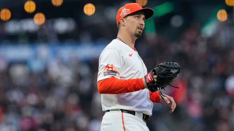 San Francisco Giants pitcher Blake Snell stands on the mound...