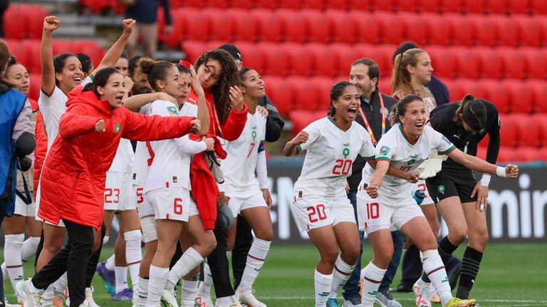 Morocco players celebrate following the Women's World Cup Group H...