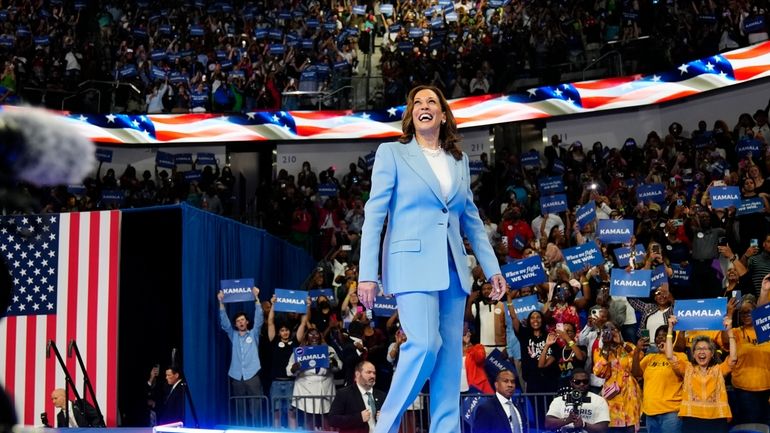 Vice President Kamala Harris admires the crowd suring a campaign...